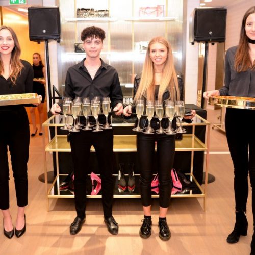 hospitality staff serving champagne at event